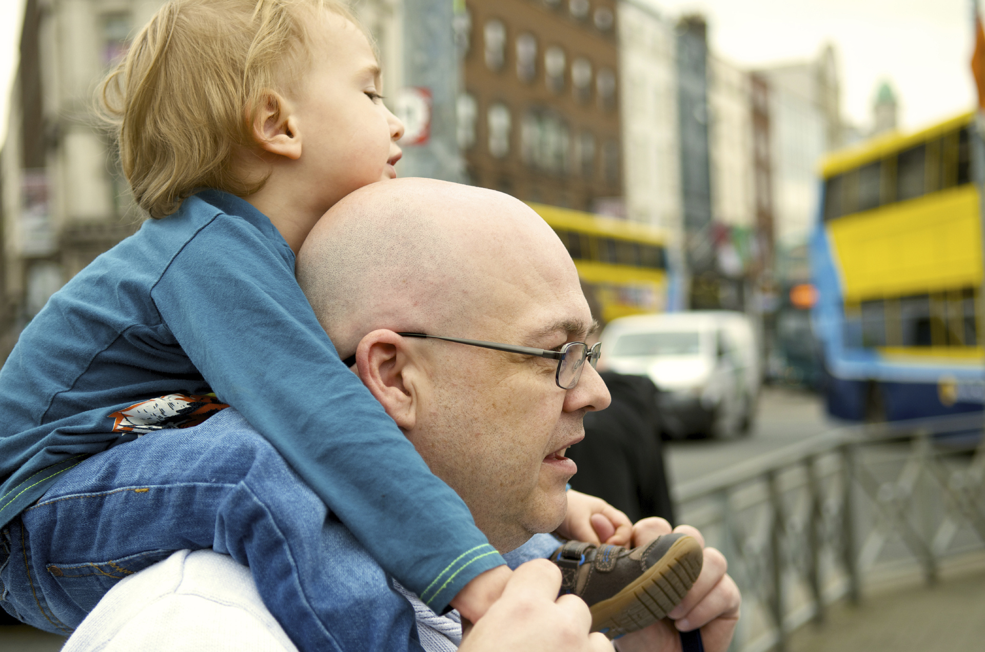 Bald man and son on shoulders.jpg